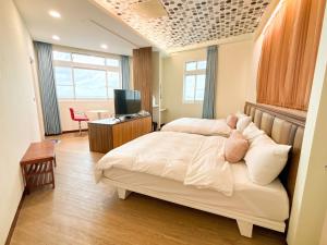 Postel nebo postele na pokoji v ubytování 綠島海灣會館Bay Resort