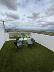 a patio with a table and chairs on a balcony at Casa de la Orden La Quintaesencia de Bullas in Bullas