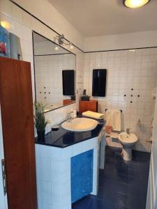 a bathroom with a sink and a toilet at Attico 26 in Perugia +41 photos