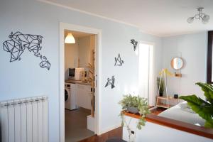 a room with a bed and a kitchen at Attico 26 in Perugia