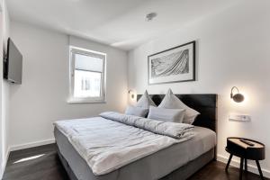 Ein Bett oder Betten in einem Zimmer der Unterkunft Haus Noena