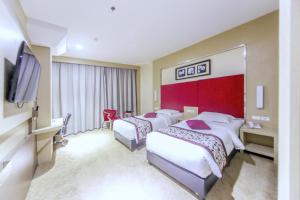 Letto o letti in una camera di Batam City Hotel