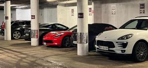 a group of cars parked in a parking garage at Hotel Kotnik Superior in Kranjska Gora