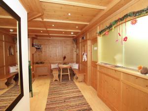 a small room with a table and a large window at Attractive holiday home in Kaltenbach on the ski slope in Stumm