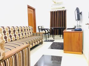 A seating area at Naveed Residency