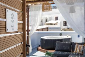 a room with a couch and a window at Bliss Luxury Suites in Lindos