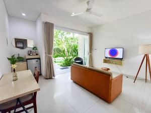 TV o dispositivi per l'intrattenimento presso Harmony Beach Suite