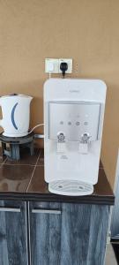 a coffee maker sitting on top of a counter at The Blue Guest House, Parking, Aulong in Taiping