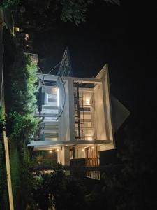 a night view of a house with lights on at Mahesa 1 in Batu