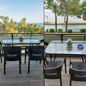 a patio with a table and chairs and a view of the beach at Sun & Sea : Malaki Seaside in Malaki