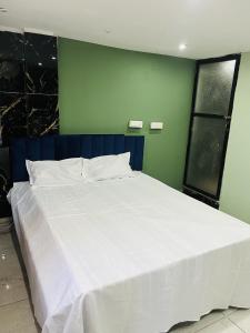 Postel nebo postele na pokoji v ubytování MK Homestay