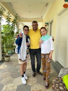 a man and two women posing for a picture at Dá Bungalow - A Vacation Abode in Agra