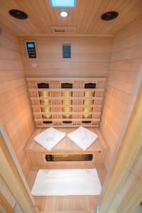 an inside view of a sauna with two white pillows at Eternity Apartmanház in Keszthely