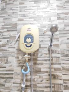 a hello kitty washer and dryer in a bathroom at 5 Blossom Loveu Homestay in Seremban