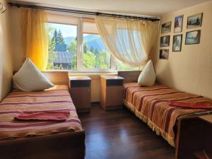 Postel nebo postele na pokoji v ubytování Карпатська Мавка