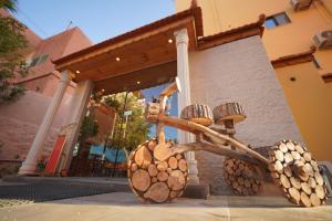 a sculpture of a tree in front of a building at Petra Plaza Hotel in Wadi Musa
