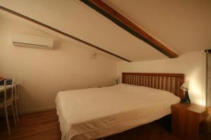 En eller flere senge i et værelse på Da Giulia