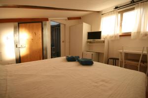 En eller flere senge i et værelse på Da Giulia