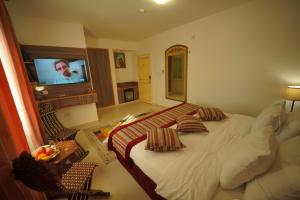 Postel nebo postele na pokoji v ubytování Petra Plaza Hotel