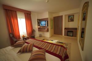 Postel nebo postele na pokoji v ubytování Petra Plaza Hotel