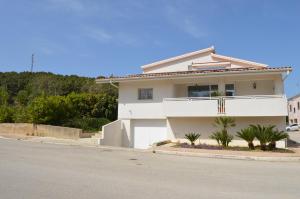 a white house on the side of a street at Casa Ferreri in Santa Ninfa