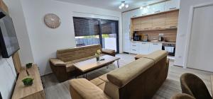 a living room with a couch and a table at Vila Ibrahimovic Vodice in Vodice
