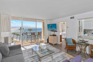 a living room with a view of the ocean at Brand New Condo with excellent reviews in Kahana