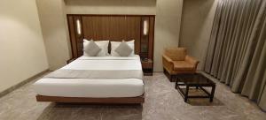 Postel nebo postele na pokoji v ubytování HOTEL ARCHANA RESIDENCY