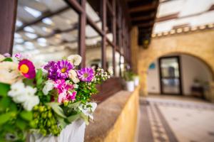 a bunch of flowers on a wall in a building at La Rosa Hotel - Selinunte in Marinella di Selinunte