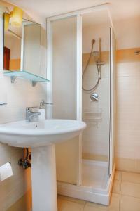 a bathroom with a sink and a shower at Adriana casa vacanze mare Etna Sicilia in Acireale