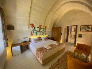 Postel nebo postele na pokoji v ubytování Mesken Cave Suites