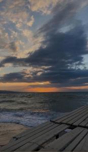 a view of the ocean from a wooden pier at Sako in Kaji-Say +7 photos