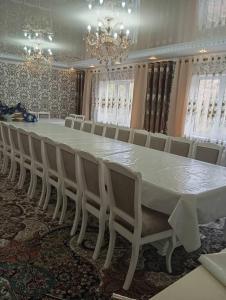 a large white table and chairs in a room at Sako in Kaji-Say