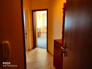 a hallway with a door leading to a room at Доли in Pomorie