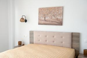 En eller flere senge i et værelse på Dream Villas Holidays