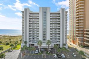 a view of a building with the ocean in the background at Tidewater 503 in Orange Beach