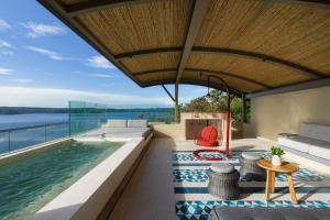 an indoor pool with a view of the water at Andaz Costa Rica Resort at Peninsula Papagayo – A concept by Hyatt in Culebra