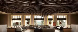 a large lobby with chairs and a large chandelier at Park Hyatt Abu Dhabi Hotel and Villas in Abu Dhabi