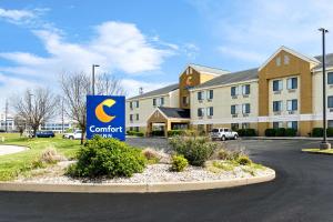 a sign in front of a building with a contract sign at Comfort Inn East in Evansville