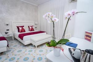 Łóżko lub łóżka w pokoju w obiekcie Hotel San Pietro