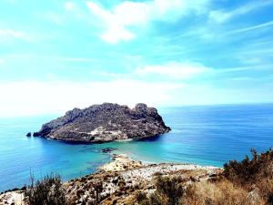 a small island in the middle of the ocean at Apartamento de Lujo en urbanización privada in Águilas