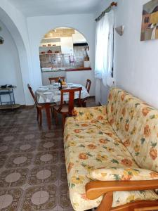 a living room with a couch and a table at BEAUTIFUL APARTMENT COSTA BLANCA PRIVATE POOL! in Oliva