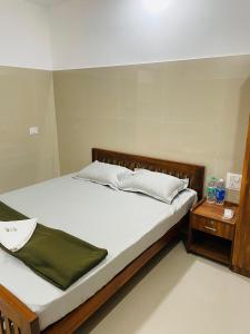 Postel nebo postele na pokoji v ubytování Asian Nest Serviced Apartments