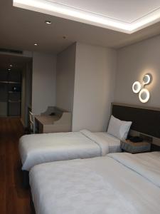 Postel nebo postele na pokoji v ubytování Theodosius Hotel