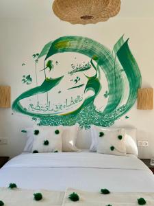 Кровать или кровати в номере RIAD OASIS D'ASILAH