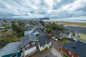 an aerial view of a town with houses and the ocean at Sand Dollar Cottage in Seaside