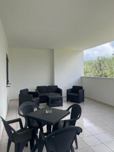 a dining room with a table and chairs at Villa Angela case vacanza in Vieste