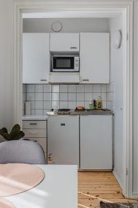 Kuchyň nebo kuchyňský kout v ubytování Nordstay - Trendy Studio by the North Harbor self check-in