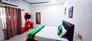 Un pat sau paturi într-o cameră la Coorg Dew Drops Resort
