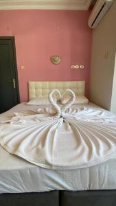 Postel nebo postele na pokoji v ubytování MALDİVES APART OTEL